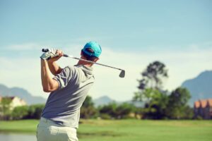 Golfer standing with the proper stance ready to hit the ball