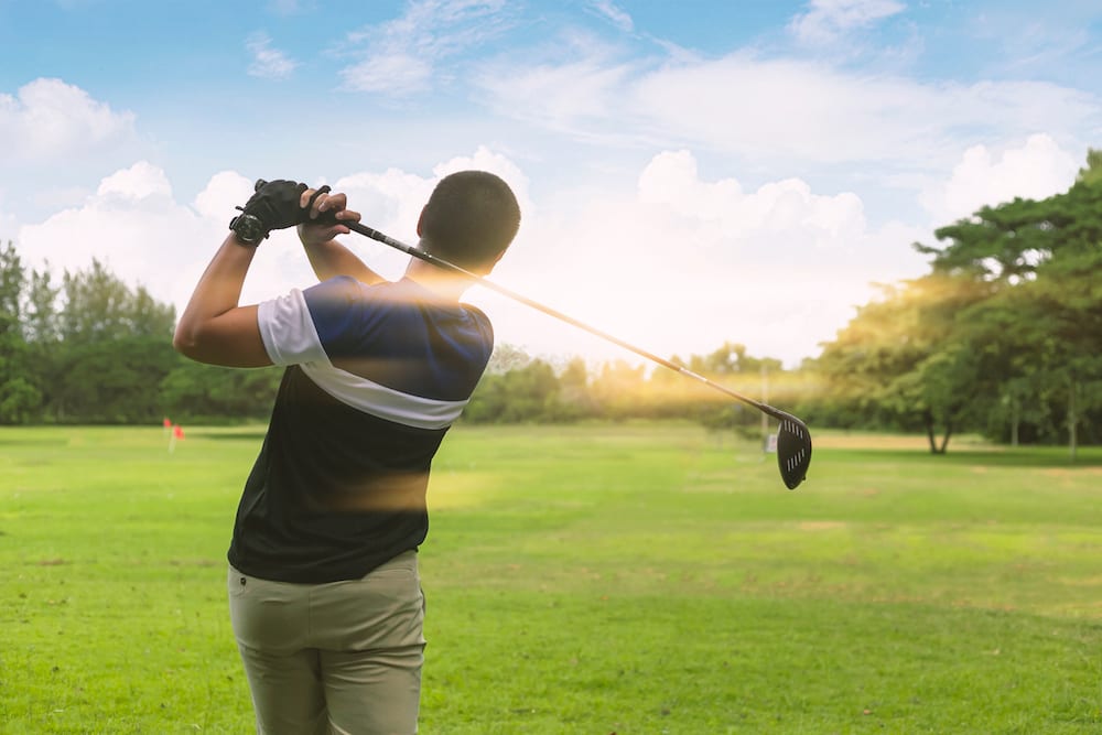 Golfer taking an iron shot