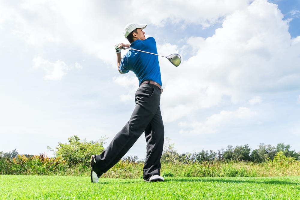 Golfer using driver to drive the ball further