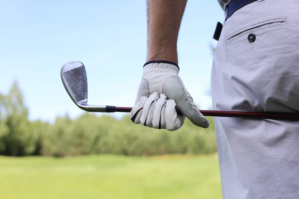 Approach shot with iron from fairway