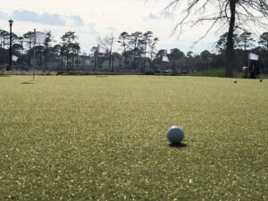 Putting green featuring GolfGreens® Pro Putt & Chip, Fringe, and DuPont™ ForeverLawn® Select HD at Living Dunes residential community in Myrtle Beach, SC