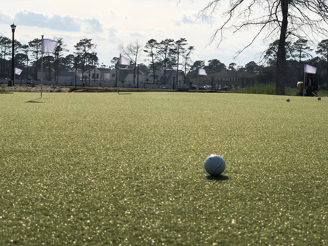 Putting green featuring GolfGreens<sup>®</sup> Pro Putt & Chip, Fringe, and DuPont™ ForeverLawn® Select HD at Living Dunes residential community in Myrtle Beach, SC