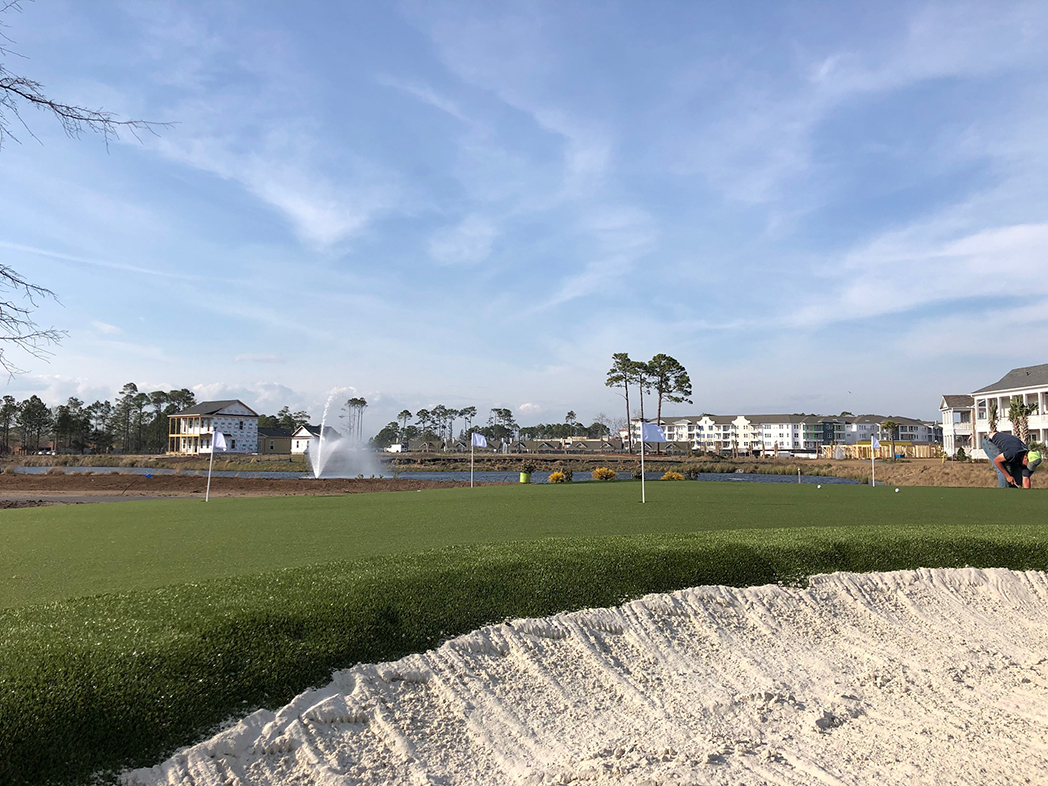 Putting green featuring GolfGreens<sup>®</sup> Pro Putt & Chip, Fringe, and DuPont™ ForeverLawn® Select HD at Living Dunes residential community in Myrtle Beach, SC